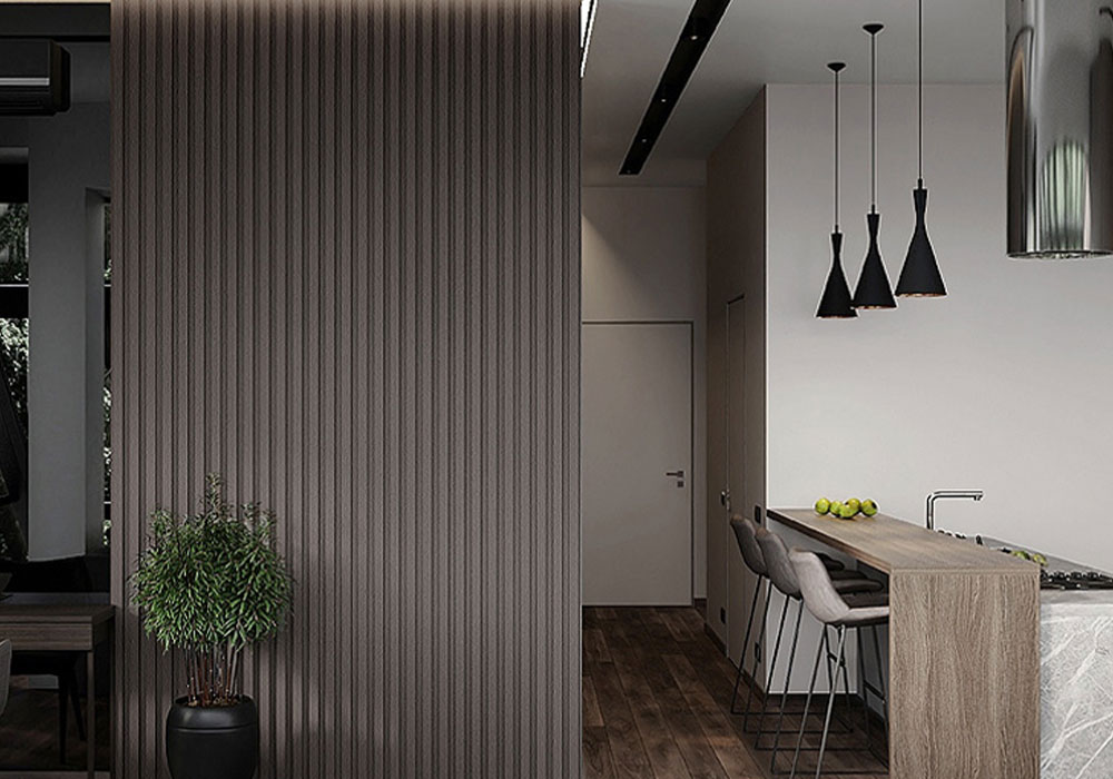 Sophisticated dining and kitchen area with dark veneer fluted panels creating a luxurious ambiance.